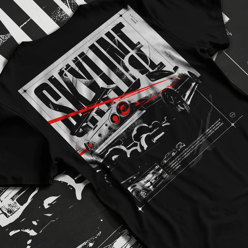Black T-shirt featuring Nissan Skyline R34 graphic in bold JDM drift streetwear design with monochrome artwork and red accents.