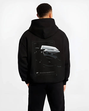 Black hoodie worn by a male model, back view, featuring BMW 750I rs turbo motorsport euro german street graphic.