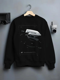 Black crewneck sweatshirt on a hanger against a grey wall, featuring BMW 750I rs turbo motorsport euro german street graphic.