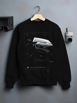 Black crewneck sweatshirt on a hanger against a grey wall, featuring BMW 750I rs turbo motorsport euro german street graphic.