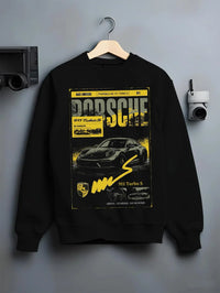 Black crewneck sweatshirt on a hanger against a grey wall, featuring Porsche 911 Turbo S rs 911 turbo racing german street graphic.