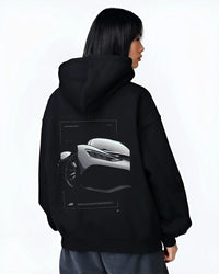 Black hoodie worn by a female model, back view, featuring Mercedes-Benz AMG rs racing motorsport street performance graphic.