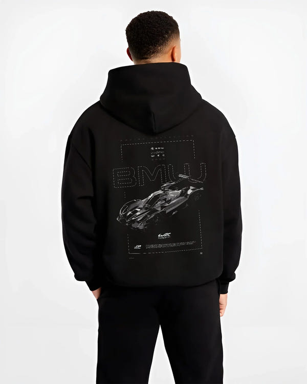 Black hoodie worn by a male model, back view, featuring BMW 202 rs racing le mans motorsport german street graphic.