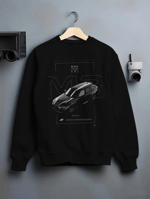 Black crewneck sweatshirt on a hanger against a grey wall, featuring BMW M3 street racing performance motorsport automotive graphic.