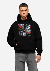 Black hoodie worn by a male model, front view, featuring BMW M4 rs racing motorsport street performance automotive graphic.