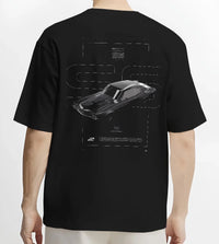 Black T-shirt worn by a male model, back view, featuring Chevrolet C10 retro classic enthusiast racing street performance graphic.