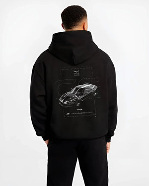 Black hoodie worn by a male model, back view, featuring Chevrolet Corvette C8R rs corvette racing motorsport american graphic.