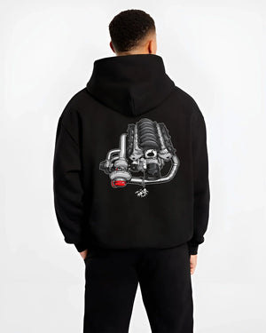 Black hoodie worn by a male model, back view, featuring supercharged v8 muscle street retro power enthusiast racing graphic.