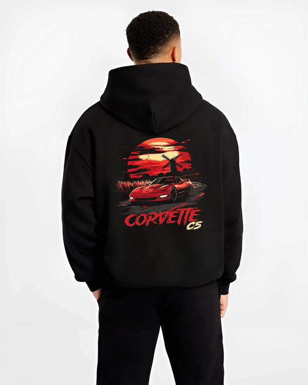 Black hoodie worn by a male model, back view, featuring Chevrolet Camaro racing drag american muscle street retro vintage graphic.