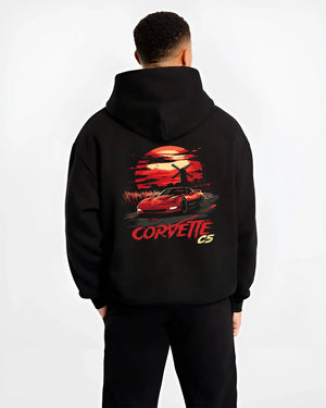 Black hoodie worn by a male model, back view, featuring Chevrolet Camaro racing drag american muscle street retro vintage graphic.