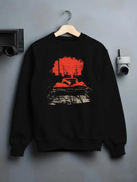 Black crewneck sweatshirt on a hanger against a grey wall, featuring Chevrolet Corvette muscle retro classic enthusiast graphic.