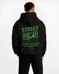 Black hoodie worn by a male model, back view, featuring Dodge Challenger racing race muscle street retro enthusiast graphic.