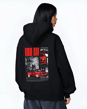 Black hoodie worn by a female model, back view, featuring BMW rs turbo racing drift motorsport euro german street retro graphic.