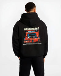 Black hoodie worn by a male model, back view, featuring BMW E30 racing drift jdm euro street retro classic graphic.