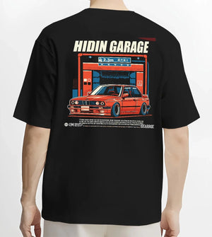 Black T-shirt worn by a male model, back view, featuring BMW E30 racing drift jdm euro street retro classic graphic.