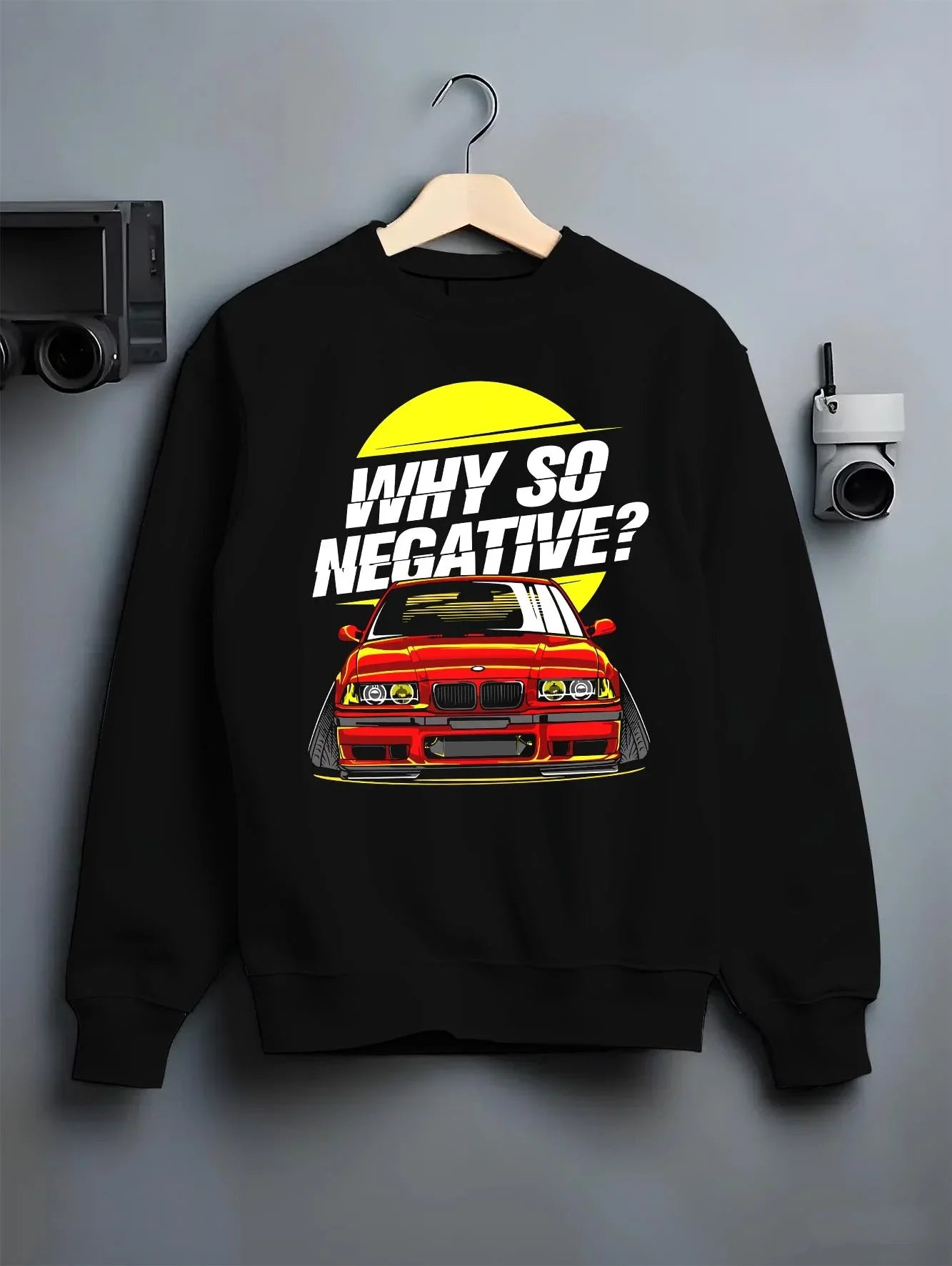 Black crewneck sweatshirt on a hanger against a grey wall, featuring BMW rs turbo racing drift motorsport euro german e39cls.
