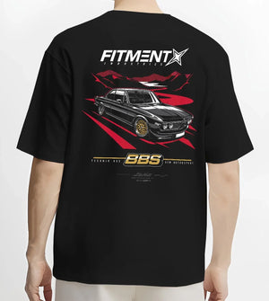 Black T-shirt worn by a male model, back view, featuring BMW rs turbo ls racing motorsport euro street retro classic graphic.