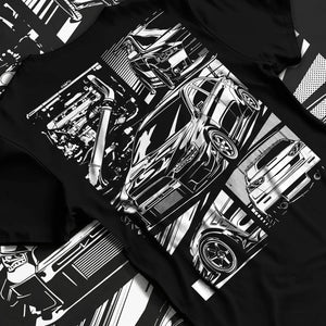 Black T-shirt laid flat with natural fabric folds, featuring Mitsubishi Lancer Evo X evo lancer turbo jdm racing street graphic.