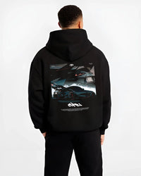 Black hoodie worn by a male model, back view, featuring Toyota Supra turbo turbocharged racing drift jdm japanese tuner graphic.
