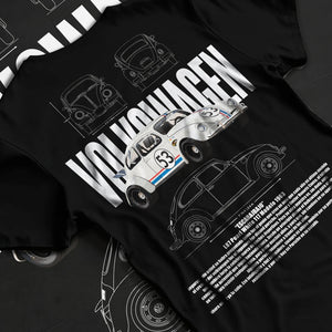 Black T-shirt laid flat with natural fabric folds, featuring Volkswagen Beetle racing classic legend street performance graphic.