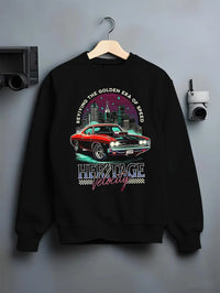 Black crewneck sweatshirt on a hanger against a grey wall, featuring Dodge Charger muscle retro racing street performance graphic.