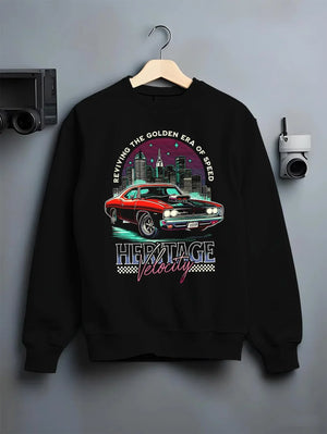 Black crewneck sweatshirt on a hanger against a grey wall, featuring Dodge Charger muscle retro racing street performance graphic.
