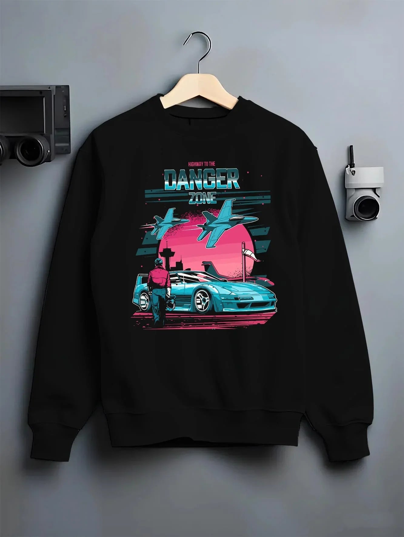 Black crewneck sweatshirt on a hanger against a grey wall, featuring ACURA NSX turbo race street racing performance graphic.