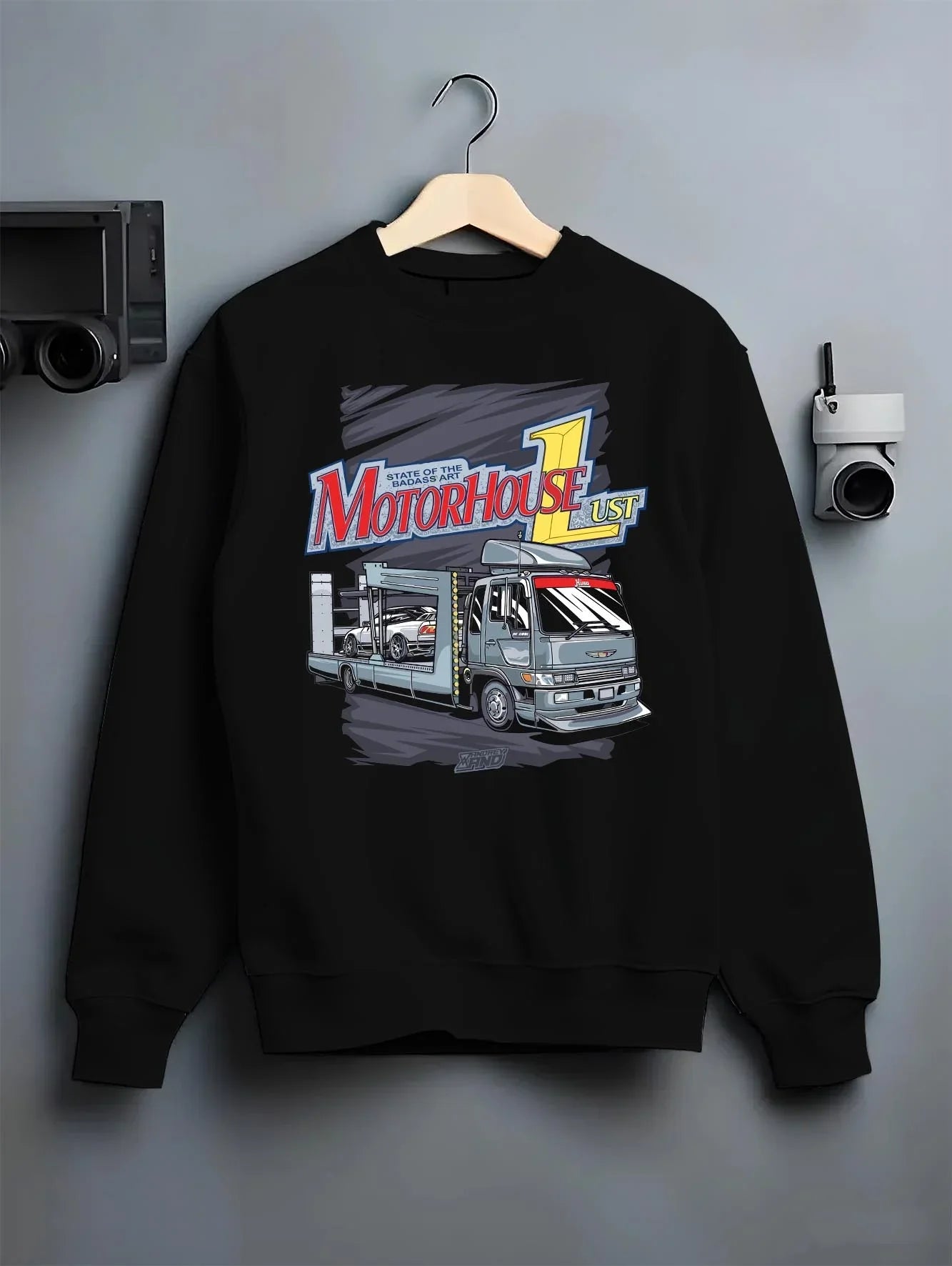 Black crewneck sweatshirt on a hanger against a grey wall, featuring rs drift japanese racing street performance motorsport graphic.