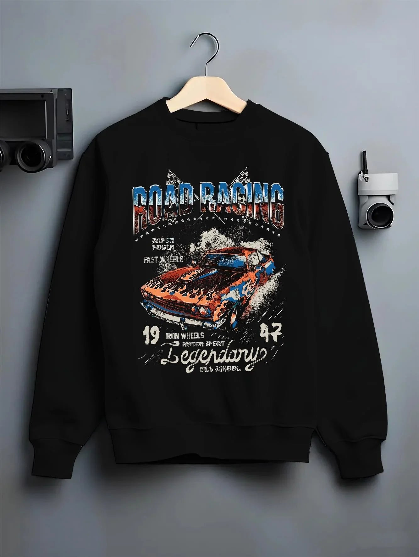 Black crewneck sweatshirt on a hanger against a grey wall, featuring Lexus IS250 jdm street racing performance motorsport graphic.