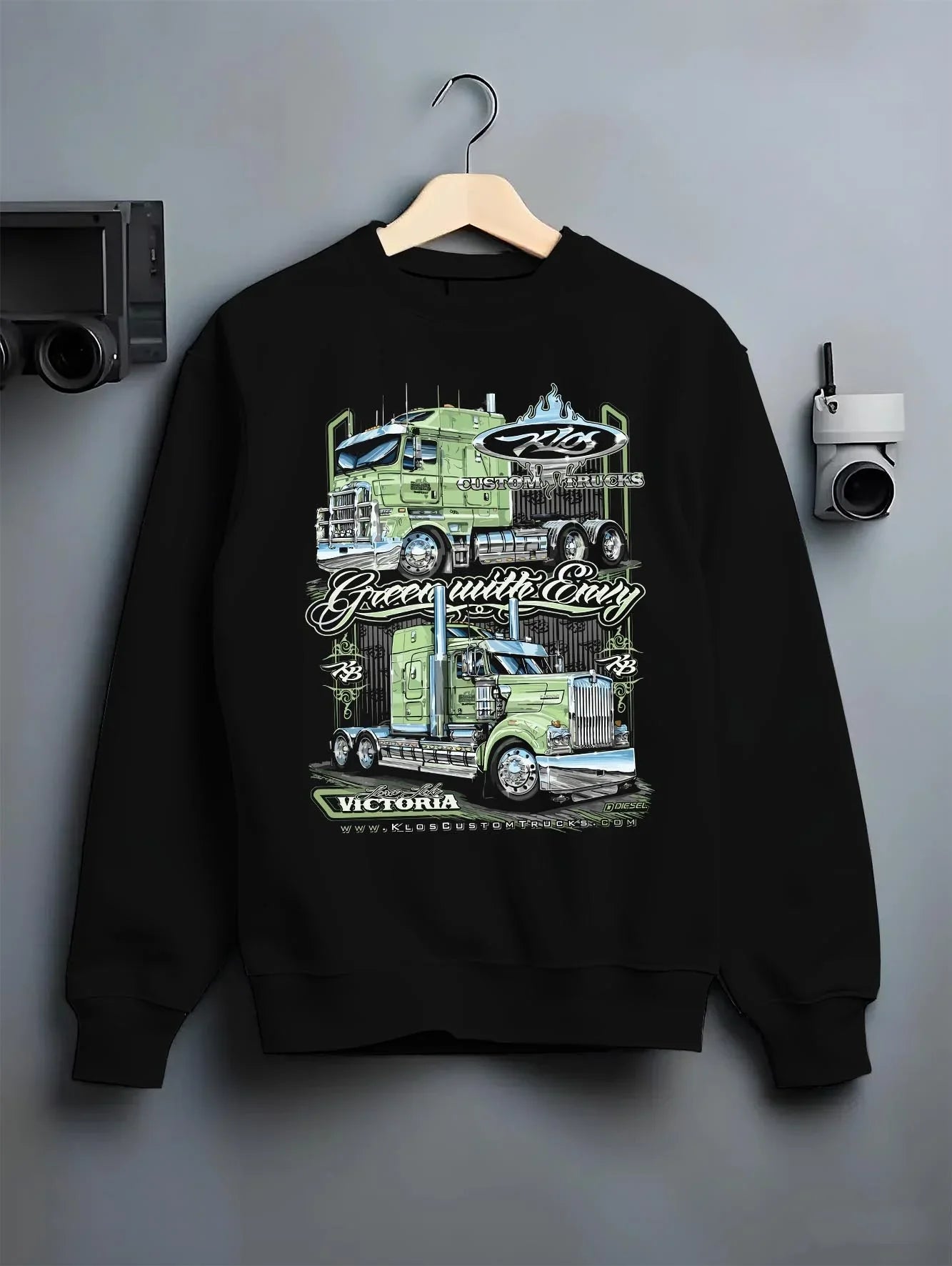 Black crewneck sweatshirt on a hanger against a grey wall, featuring rs street racing performance motorsport automotive graphic.