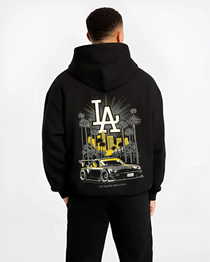 Black hoodie worn by a male model, back view, featuring racing street performance motorsport automotive enthusiast power larun.