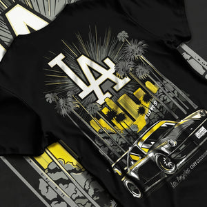 Black T-shirt laid flat with natural fabric folds, featuring racing street performance motorsport automotive enthusiast larun.