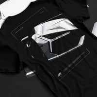 Black T-shirt laid flat with natural fabric folds, featuring SKYLINE street racing performance motorsport automotive graphic.