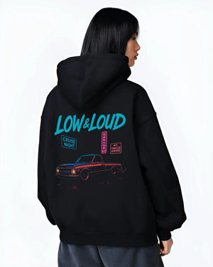 Black hoodie worn by a female model, back view, featuring street retro classic racing performance motorsport automotive graphic.