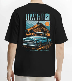 Black T-shirt worn by a male model, back view, featuring Chevrolet retro classic racing street performance motorsport graphic.