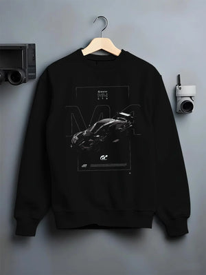 Black crewneck sweatshirt on a hanger against a grey wall, featuring BMW M4 gt3 racing race gran turismo street performance graphic.