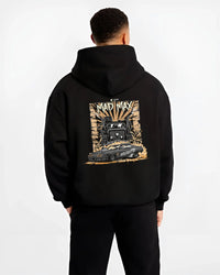 Black hoodie worn by a male model, back view, featuring enthusiast racing street performance motorsport automotive power madmx.
