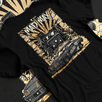 Black T-shirt laid flat with natural fabric folds, featuring enthusiast racing street performance motorsport automotive madmx.