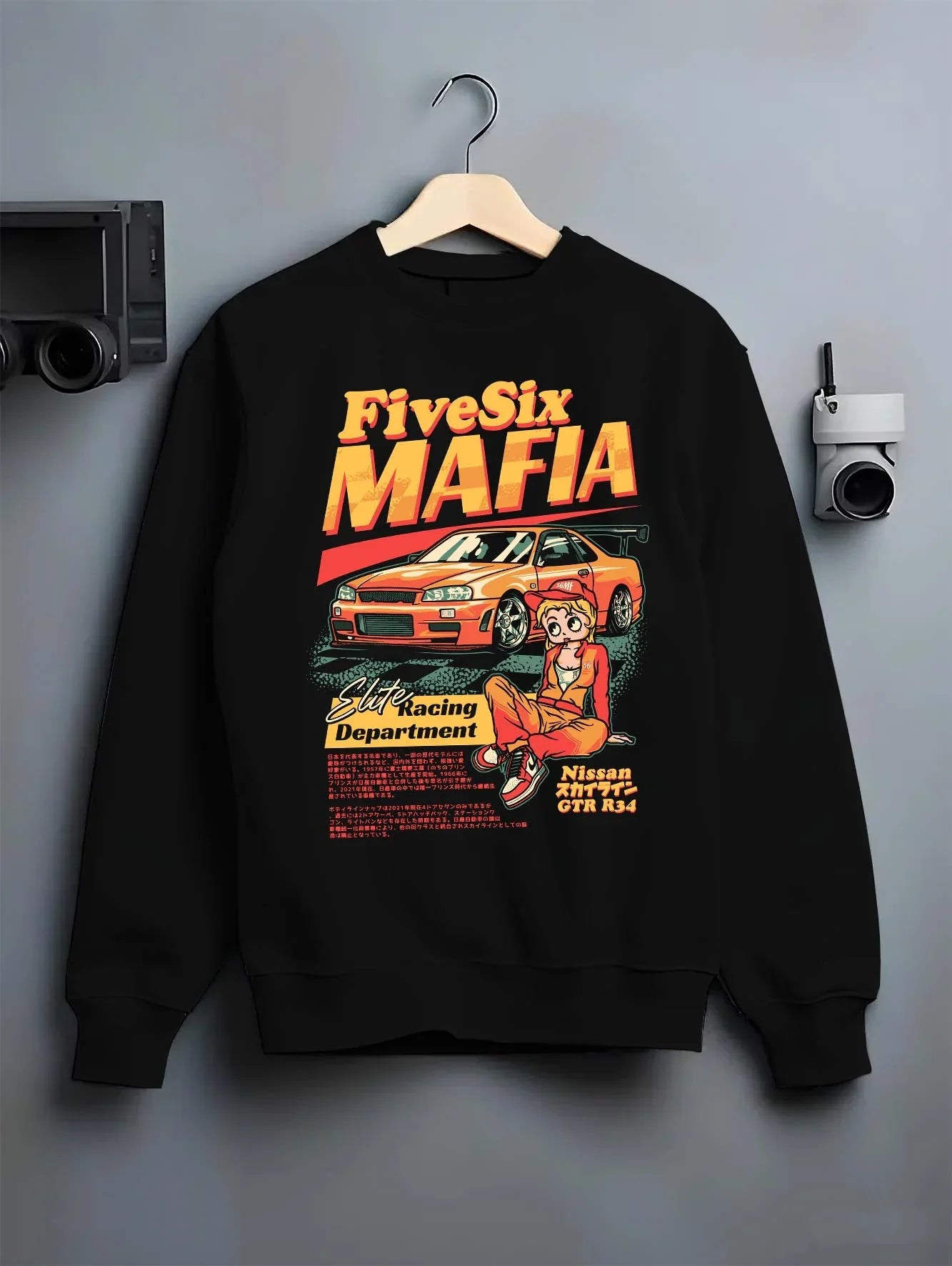 Black crewneck sweatshirt on a hanger against a grey wall, featuring Nissan Skyline racing drift japanese tuner street graphic.