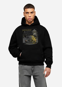 Black hoodie worn by a male model, front view, featuring SKYLINE street retro racing performance motorsport automotive graphic.