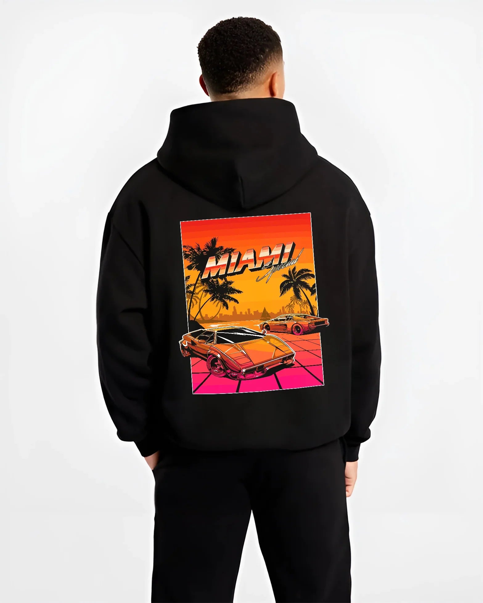 Black hoodie worn by a male model, back view, featuring street retro racing performance motorsport automotive enthusiast miams1.
