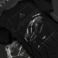 Black T-shirt laid flat with natural fabric folds, featuring Mitsubishi EVO turbo turbocharged racing drift jdm japanese graphic.