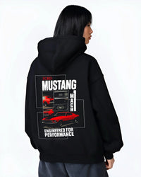 Black hoodie worn by a female model, back view, featuring MUSTANG racing drag american muscle street classic enthusiast graphic.