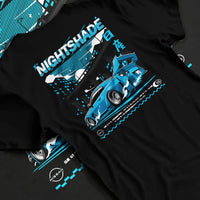 Black T-shirt laid flat with natural fabric folds, featuring Nissan GT-R R35 gt r r35 skyline racing drift jdm japanese graphic.