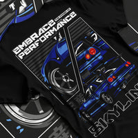 Black T-shirt laid flat with natural fabric folds, featuring Nissan SKYLINE r32 turbo turbocharged racing drift jdm street graphic.