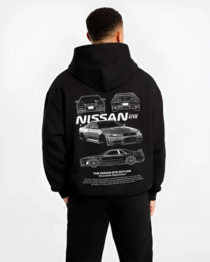 Black hoodie worn by a male model, back view, featuring Nissan Skyline R34 gtr r34 skyline drift jdm japanese tuner street graphic.