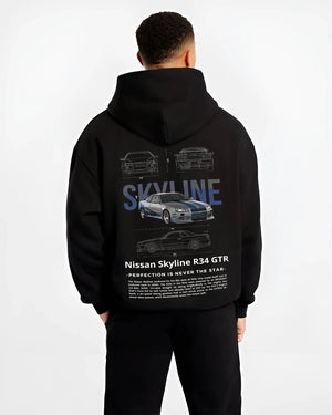 Black hoodie worn by a male model, back view, featuring Nissan Skyline R34 r34 skyline drift jdm japanese tuner graphic.