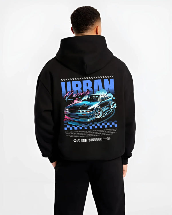 Black hoodie worn by a male model, back view, featuring Nissan Skyline racing drift jdm japanese street retro graphic.