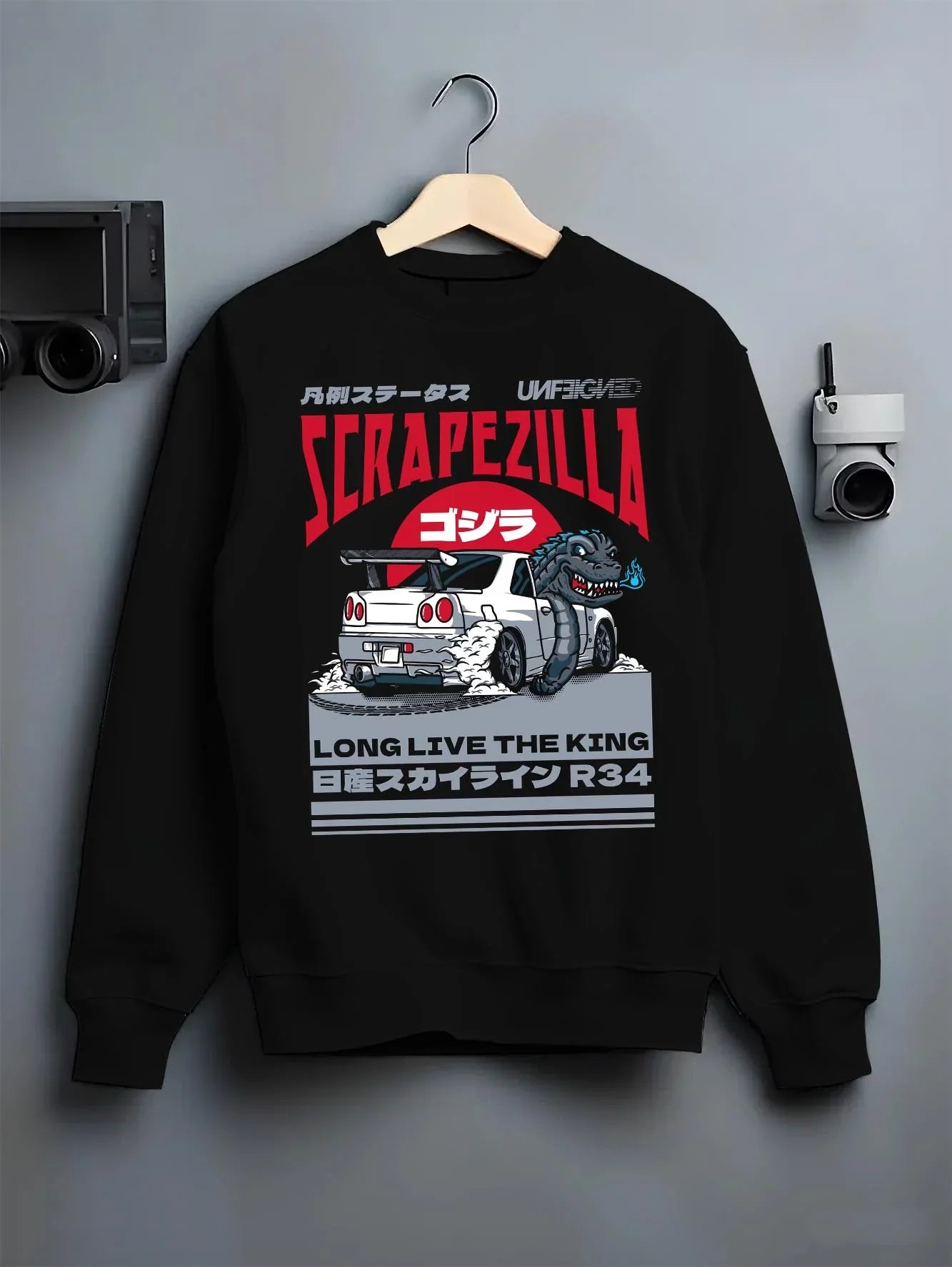 Black crewneck sweatshirt on a hanger against a grey wall, featuring Nissan 350Z rs turbo racing drift motorsport jdm graphic.