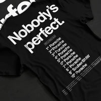 Black T-shirt laid flat with natural fabric folds, featuring Porsche rs racing le mans motorsport street performance graphic.